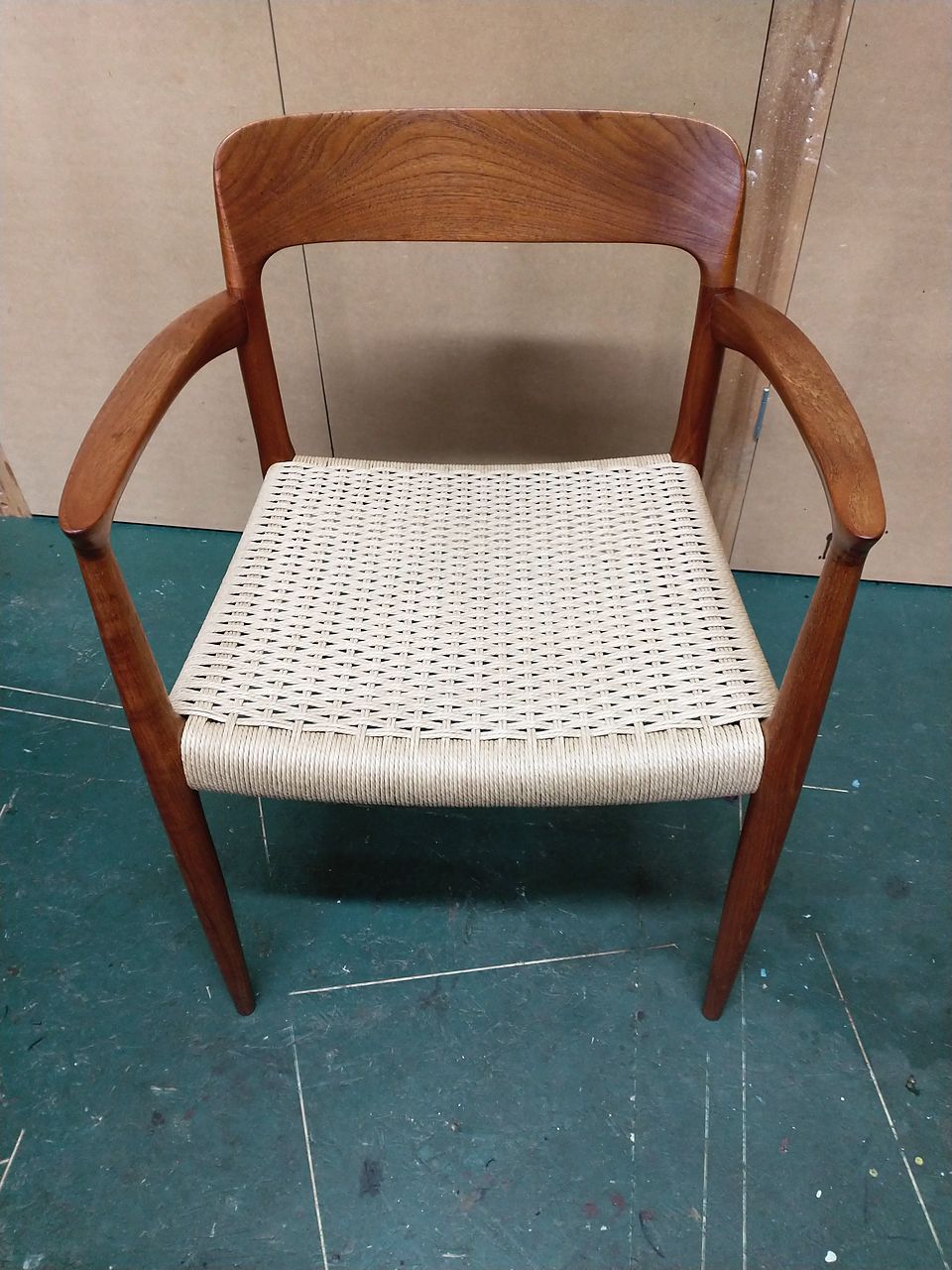 The same mid-century armchair with a newly woven paper cord seat